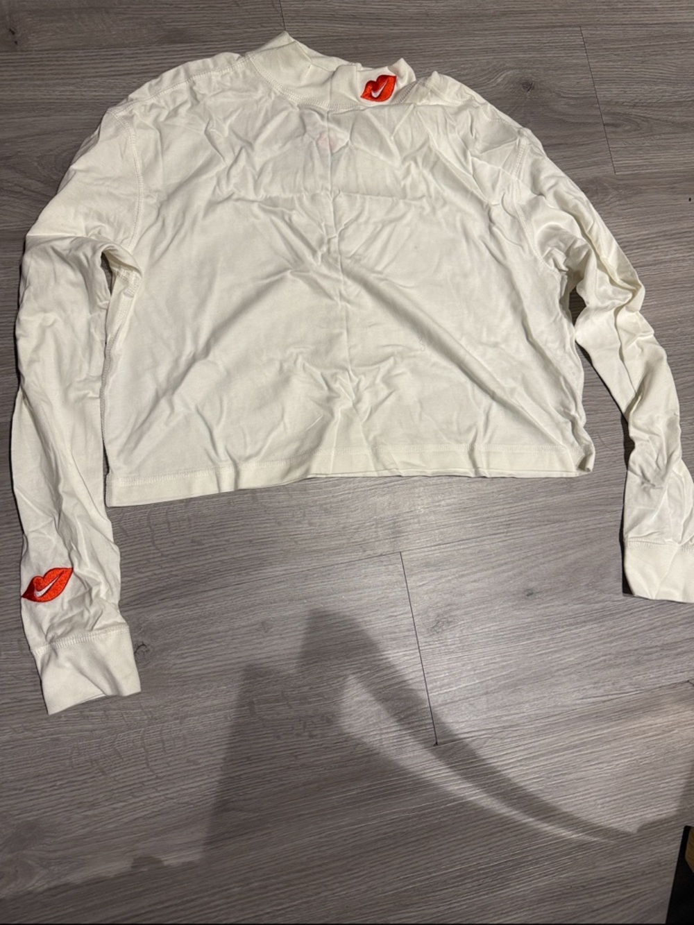 Nike Women's White Long Sleeve Crop Top with Red Lip Accents